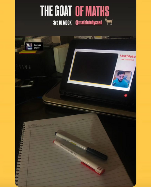 The GOAT of Maths O Level mock exam setup with Mathlete by Saad live stream and blank notebook